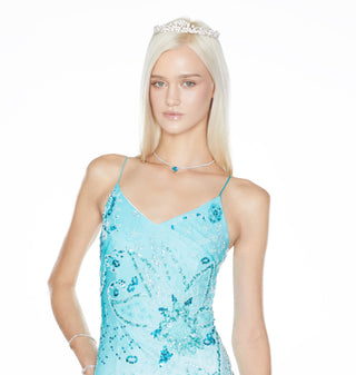 Woman wearing a light blue floral dress on a white background cybersweetie The Marina dress