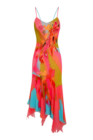 Colorful dress with floral pattern on a white background Cybersweeties Model wearing a colourful evening dress with floral patterns on a white background. The Tulipa cocktail dress. 2000s, vintage style 