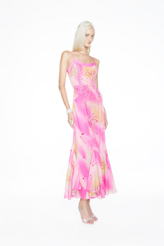 Effortlessly chic 90s vintage-inspired evening gown with a hand-beaded bodice and a soft, romantic flowing skirt.