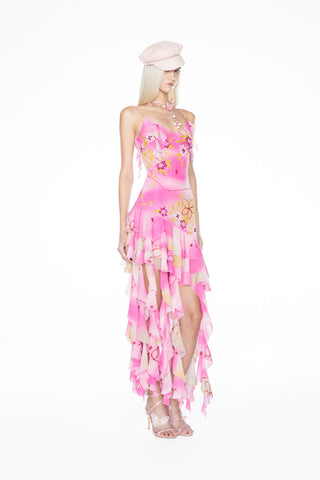 Effortlessly chic Y2K-style mini slip dress with a playful ruffled hem and light-catching hand embellishments.