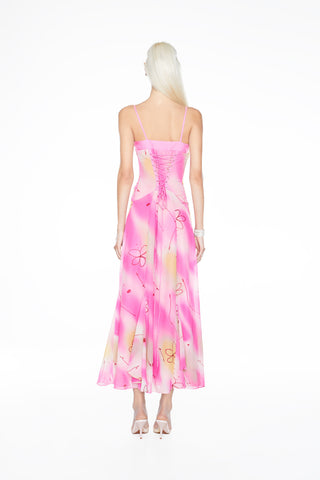 Iconic 90s-inspired sculpted corset gown with shimmering hand-beaded accents, perfect for an elegant wedding guest statement.