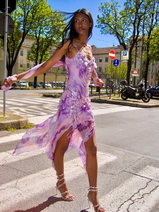 The Candy Crush asymmetrical silk cocktail dress in a vibrant hand-painted palette. A bias-cut, slinky silhouette designed in London for a luxury Italian holiday.