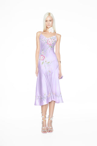 Whimsical fairy aesthetic light purple satin gown featuring hand-beaded flowers and a fluid, bias-cut silhouette. Light purple satin formal dress adorned with delicate hand-crafted beaded blooms, including a concealed zip and matching shawl.
